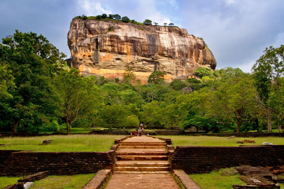 Sigiriya Lion Rock fortress rising above lush green gardens